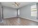 Light-filled bedroom with wood-look floors at 1858 Norvell Ave, North Port, FL 34286