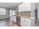 Kitchen features stainless steel appliances and white cabinets at 1858 Norvell Ave, North Port, FL 34286