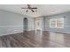 Bright living room with wood-look floors and neutral walls at 1858 Norvell Ave, North Port, FL 34286