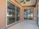 Covered patio with sliding glass doors at 1858 Norvell Ave, North Port, FL 34286