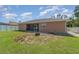 Large backyard with firepit and screened porch at 1858 Norvell Ave, North Port, FL 34286