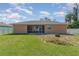 House exterior and backyard with fire pit at 1858 Norvell Ave, North Port, FL 34286