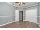 Bright bedroom with double door closet and wood-look floors at 1858 Norvell Ave, North Port, FL 34286