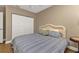 Comfortable bedroom with a wicker bed frame and built-in closet at 101 N Marion Ct # 122, Punta Gorda, FL 33950