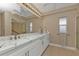 Modern bathroom with double vanity and walk-in shower at 101 N Marion Ct # 122, Punta Gorda, FL 33950