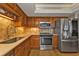 Modern kitchen with stainless steel appliances and wood cabinets at 101 N Marion Ct # 122, Punta Gorda, FL 33950