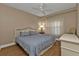 Bright bedroom with king-size bed and ceiling fan at 101 N Marion Ct # 122, Punta Gorda, FL 33950