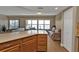 Kitchen with island and view into living room with water views at 101 N Marion Ct # 122, Punta Gorda, FL 33950