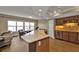 Kitchen with stainless steel appliances and island overlooking living room and water view at 101 N Marion Ct # 122, Punta Gorda, FL 33950