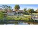 Home's backyard features a canal-side deck and lush landscaping at 372 Cory St, Port Charlotte, FL 33953