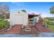 Outdoor bar area with colorful decor and a tiki-themed mural at 372 Cory St, Port Charlotte, FL 33953