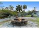 Firepit area with brick fire pit and flagstone patio at 372 Cory St, Port Charlotte, FL 33953