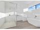 Luxurious bathroom with soaking tub, walk-in shower, and modern vanity at 17315 Cape Horn Blvd, Punta Gorda, FL 33955