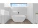 Elegant bathroom featuring a freestanding bathtub and marble accents at 17315 Cape Horn Blvd, Punta Gorda, FL 33955