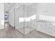 Spa-like bathroom with a large walk-in shower and white cabinetry at 17315 Cape Horn Blvd, Punta Gorda, FL 33955