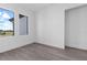 Spacious bedroom with grey flooring and a large window at 17315 Cape Horn Blvd, Punta Gorda, FL 33955