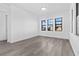 Spacious bedroom with gray vinyl flooring and large windows at 17315 Cape Horn Blvd, Punta Gorda, FL 33955