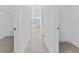 Bright hallway with light flooring and access to closets at 17315 Cape Horn Blvd, Punta Gorda, FL 33955