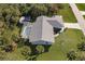 An aerial view of the home showcasing the roofline and pool at 18370 Inwood Ave, Port Charlotte, FL 33948