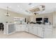 Bright kitchen with island, stainless steel appliances, and views to backyard at 24211 Savory Ln, Punta Gorda, FL 33955