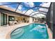 Inviting kidney-shaped pool with a screened enclosure and spacious patio at 24211 Savory Ln, Punta Gorda, FL 33955