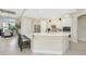 Spacious kitchen with island, stainless steel appliances, and white cabinetry at 24211 Savory Ln, Punta Gorda, FL 33955
