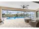 Enclosed pool and patio area with seating and water views at 24211 Savory Ln, Punta Gorda, FL 33955