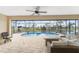 Relaxing screened-in pool area with patio furniture and tranquil views at 24211 Savory Ln, Punta Gorda, FL 33955