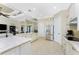 Open concept kitchen with custom cabinetry and expansive countertops at 24211 Savory Ln, Punta Gorda, FL 33955
