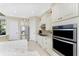 Modern kitchen featuring stainless steel appliances and ample counter space at 24211 Savory Ln, Punta Gorda, FL 33955