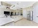 Large kitchen boasting stainless steel appliances and an island with seating at 24211 Savory Ln, Punta Gorda, FL 33955