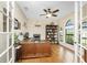 Bright home office features built-in shelving and hardwood floors at 24211 Savory Ln, Punta Gorda, FL 33955