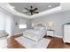 Large main bedroom with plush carpet and tray ceiling at 24211 Savory Ln, Punta Gorda, FL 33955