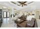Bright and airy living room with a comfortable seating area and access to the kitchen at 24211 Savory Ln, Punta Gorda, FL 33955