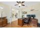 Spacious home office with hardwood floors and views into adjacent rooms at 24211 Savory Ln, Punta Gorda, FL 33955