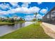 Stunning view of a canal and lush landscaping from backyard at 24211 Savory Ln, Punta Gorda, FL 33955