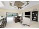 Open concept living room with a view of the pool and golf course at 24211 Savory Ln, Punta Gorda, FL 33955