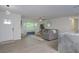 Bright living room featuring a bay window, modern furnishings, wood floors, and elegant decor at 25 Caddy Rd, Rotonda West, FL 33947