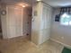 Hallway with double door closets and tiled floor at 3310 Loveland Blvd # 604, Port Charlotte, FL 33980