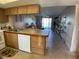 Kitchen with wood cabinets and modern appliances at 3310 Loveland Blvd # 604, Port Charlotte, FL 33980