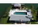 Community pool area with lounge chairs at 3310 Loveland Blvd # 604, Port Charlotte, FL 33980