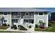Exterior view of a two-story building with stairs at 3310 Loveland Blvd # 604, Port Charlotte, FL 33980