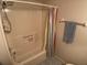 Clean bathroom with tub and shower at 3310 Loveland Blvd # 604, Port Charlotte, FL 33980
