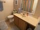 Guest bathroom with vanity, shower, and toilet at 3310 Loveland Blvd # 604, Port Charlotte, FL 33980