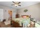 Bedroom with access to bathroom and features a tropical-themed bedding at 7093 Mikasa Dr, Punta Gorda, FL 33950