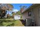 Side yard view with shed and AC unit at 766 Merrick Nw Ln, Port Charlotte, FL 33948