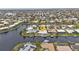 Aerial view showcasing the property's waterfront location and community setting at 950 Genoa Ct, Punta Gorda, FL 33950