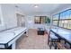 Spacious game room, including an air hockey table and comfortable seating at 3173 S Cranberry Blvd, North Port, FL 34286