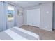 Bedroom with a queen bed, and ample closet space at 3173 S Cranberry Blvd, North Port, FL 34286