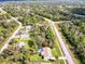 Aerial view of neighborhood with houses and lush greenery at 3173 S Cranberry Blvd, North Port, FL 34286